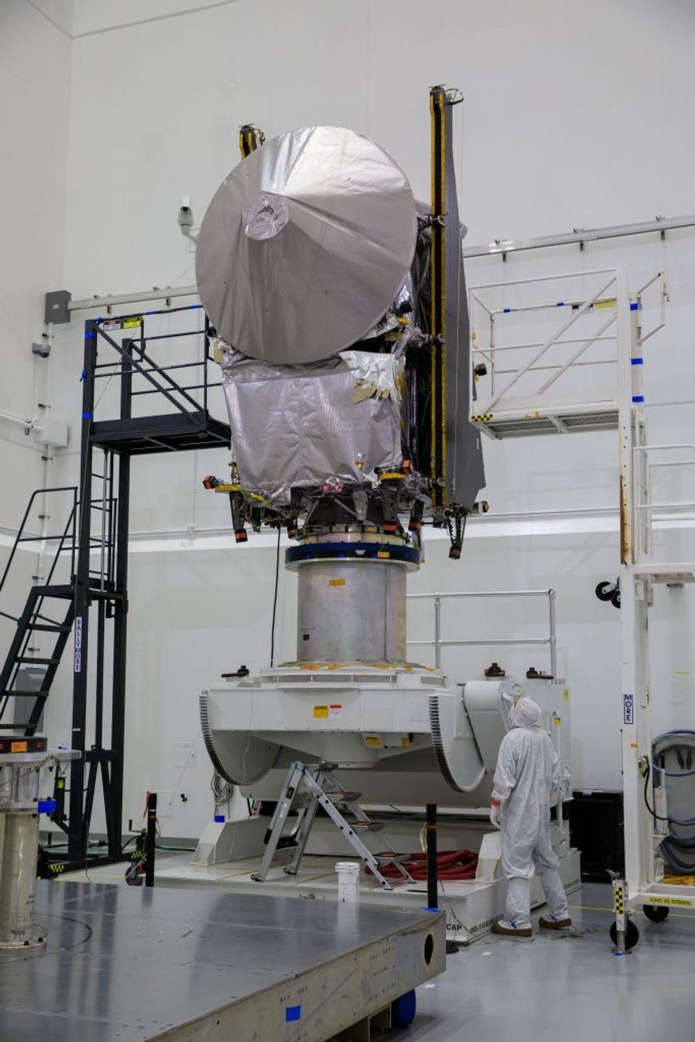 \u200bNASA\u2019s Lucy spacecraft, with its high gain antenna attached, is on a rotation stand inside the Astrotech Space Operations Facility in Titusville, Florida