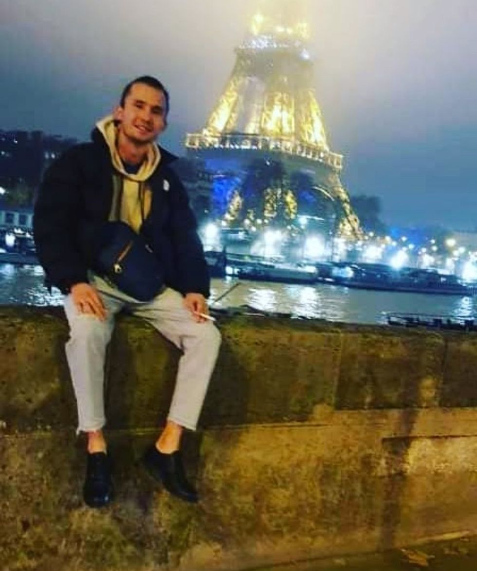 u200bNikzad posing by the Eiffel Tower in Paris