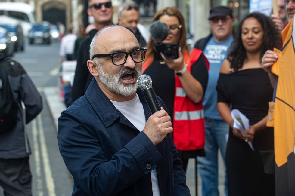 \u200bOnay Kasab addresses the protest outside the Conservative party fundraiser at the Carlton Club