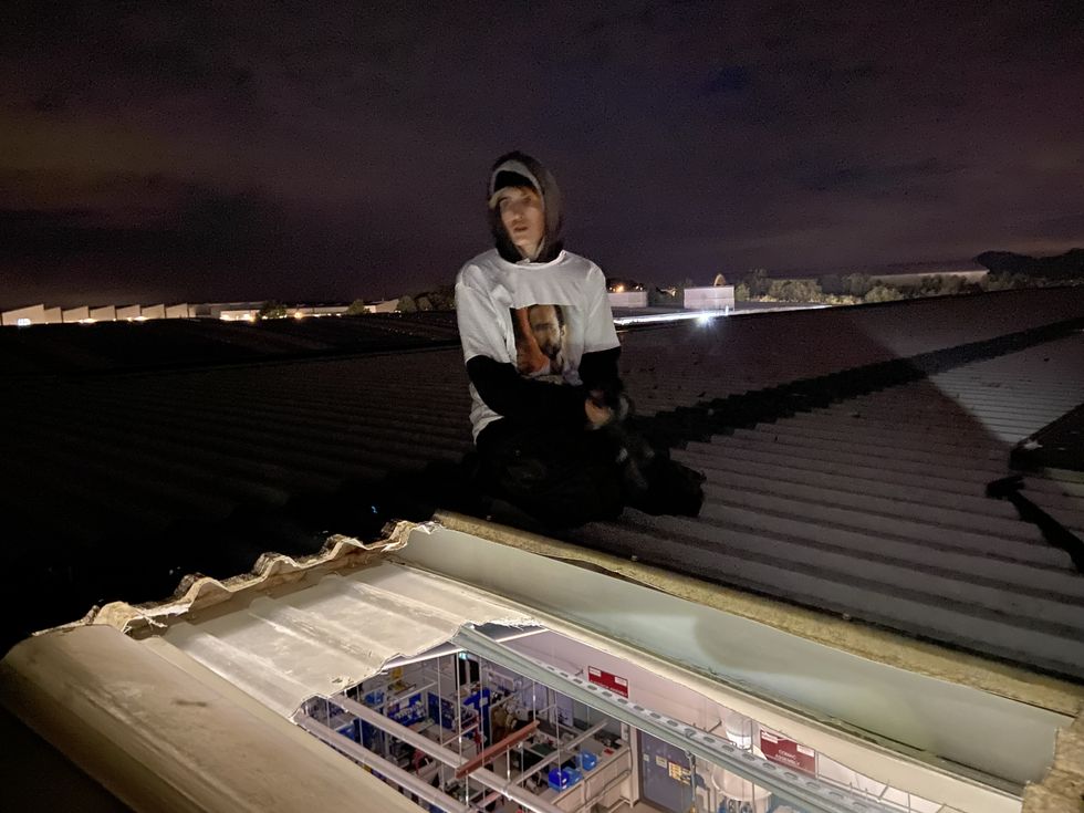 \u200bOne of the activists on top of the roof