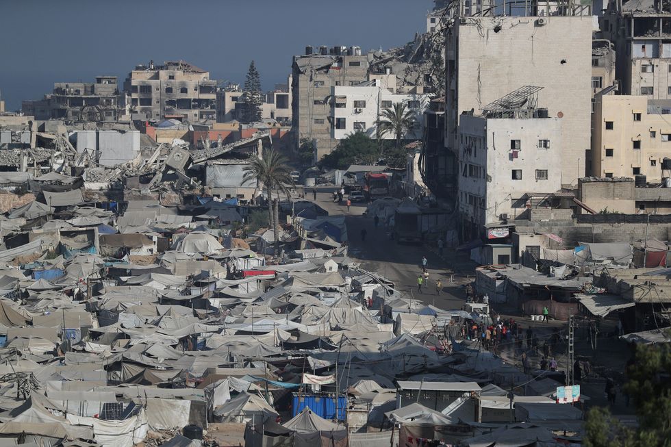 \u200bPalestinians displaced by the Israeli military offensive take shelter in a tent camp,