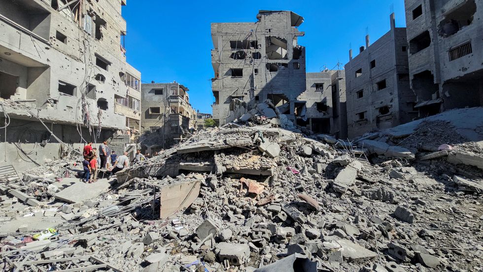 \u200bPalestinians gather at the site of Israeli strikes on houses and residential buildings, amid the ongoing Israel-Hamas conflict, in Beit Lahiya