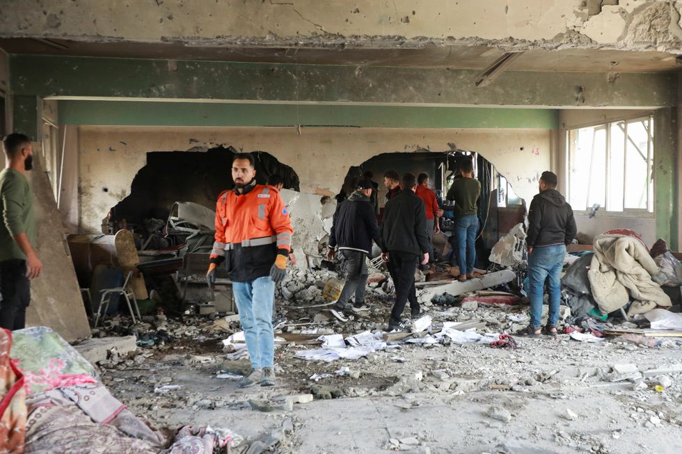 \u200bPalestinians inspect the site of an Israeli strike on a school sheltering displaced people