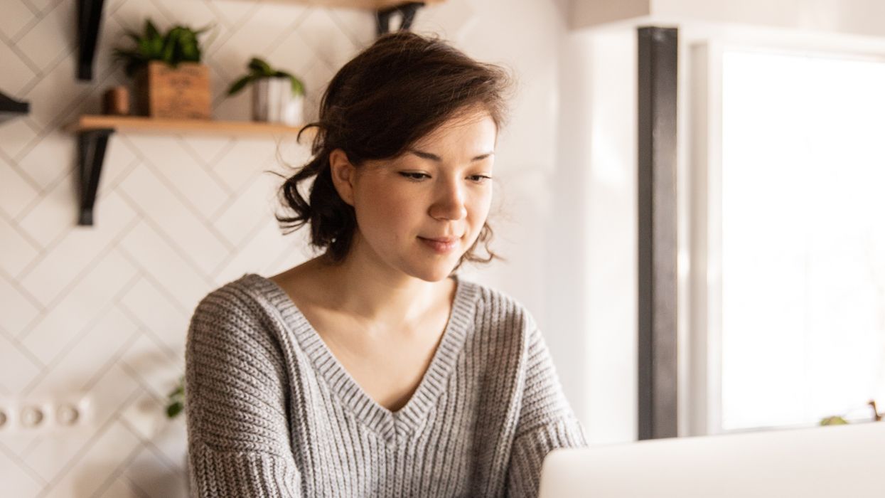 \u200bPension saver looks at laptop