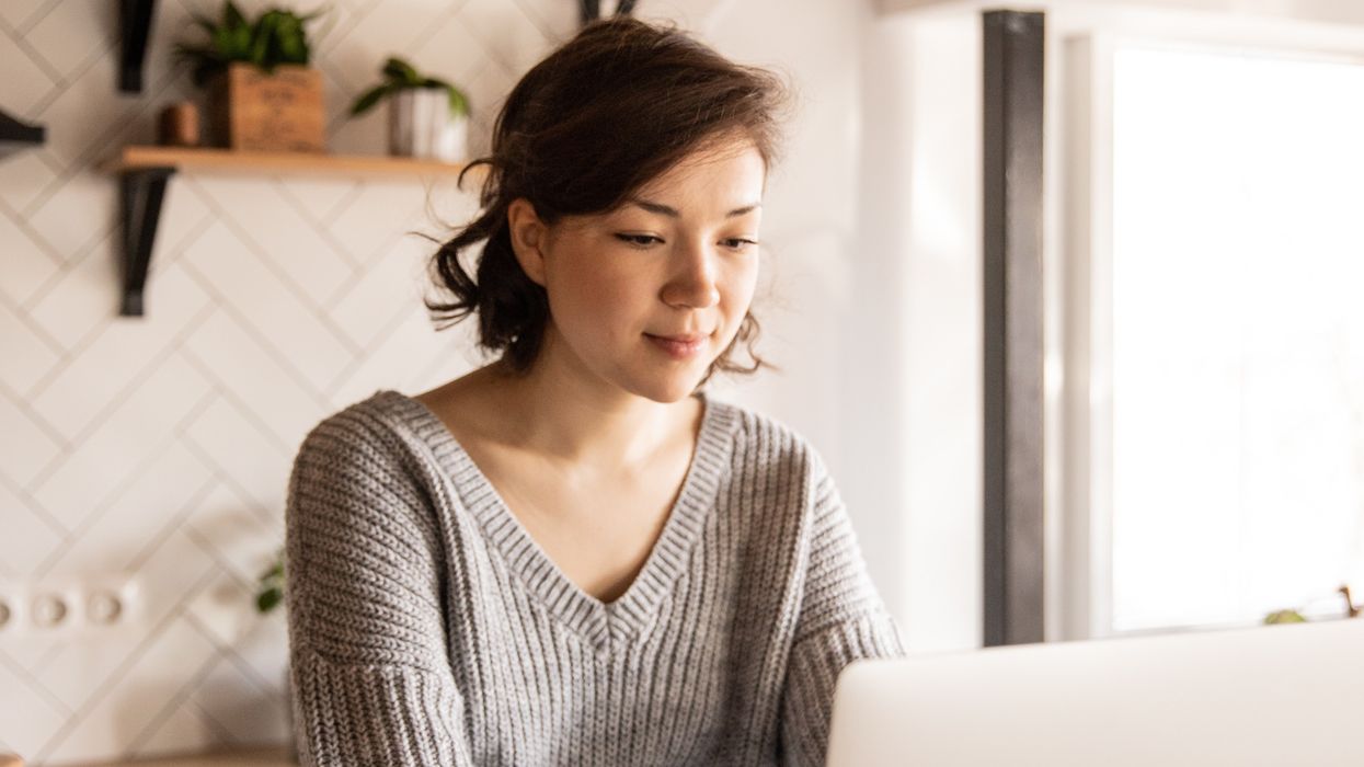 \u200bPension saver looks at laptop