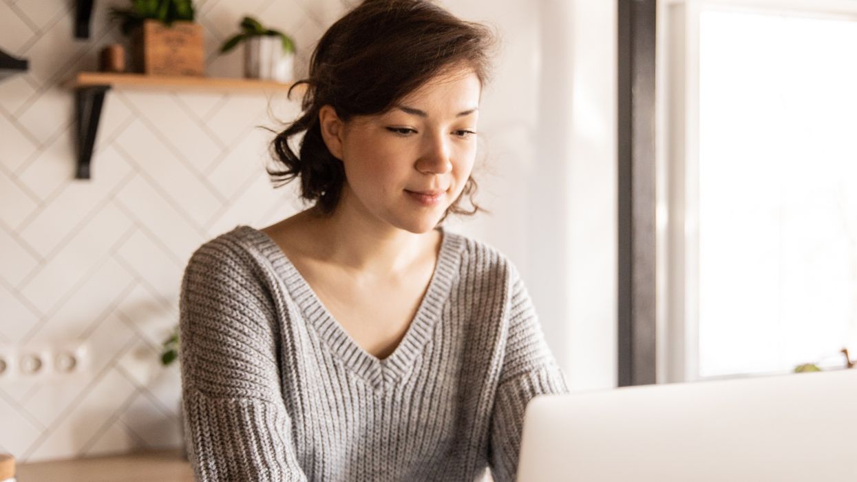 \u200bPension saver looks at laptop