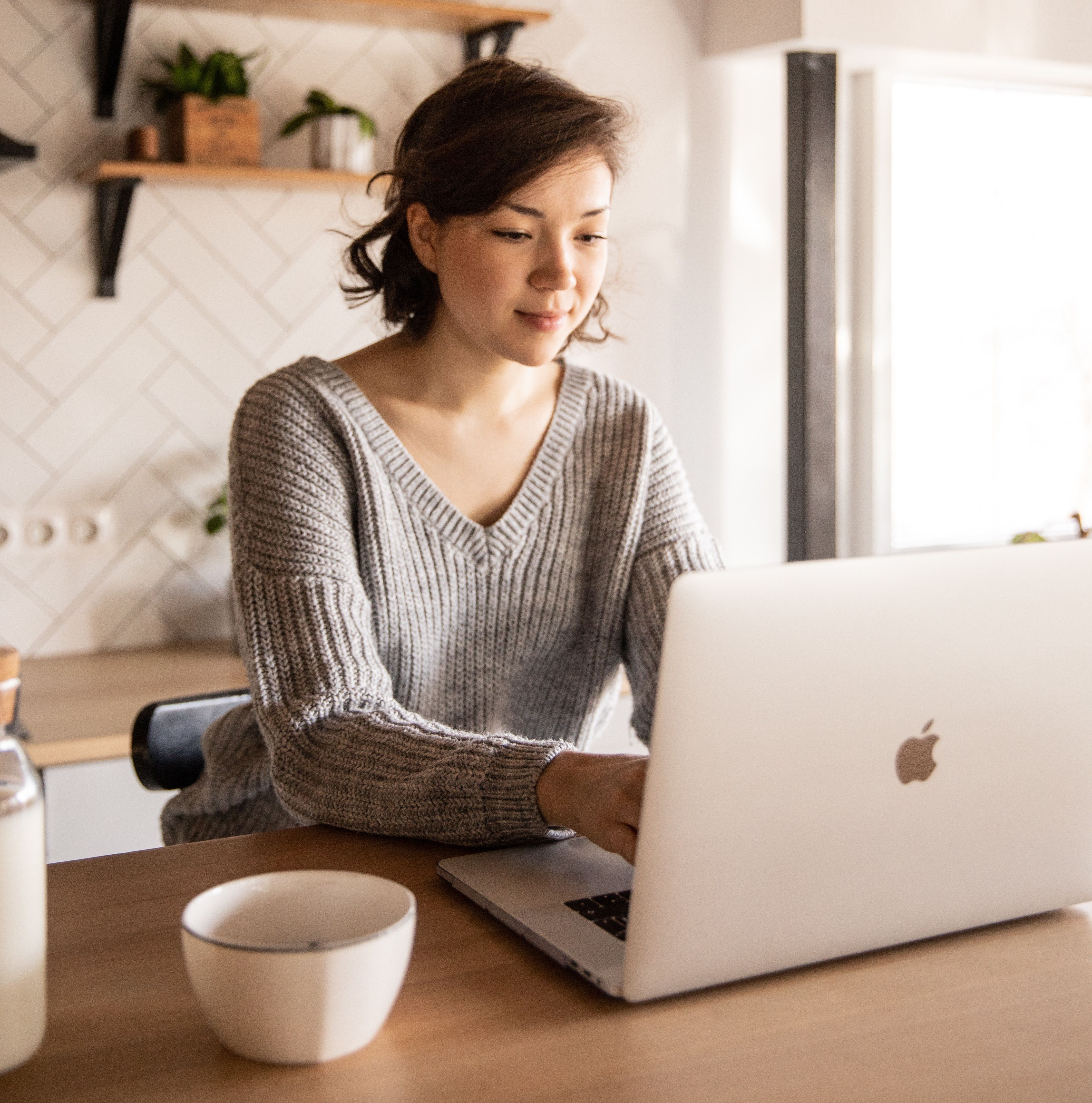 \u200bPension saver looks at laptop