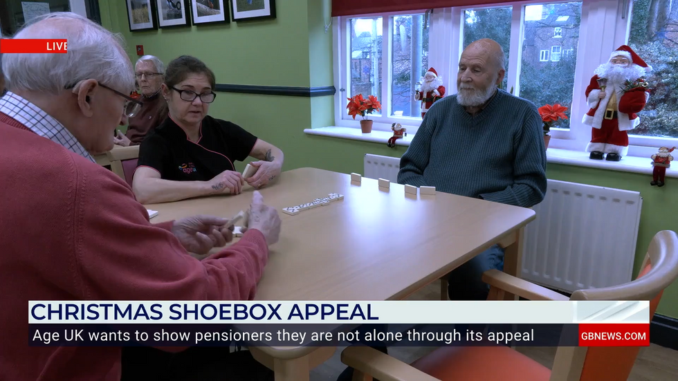 \u200bPensioners playing dominoes at a care home