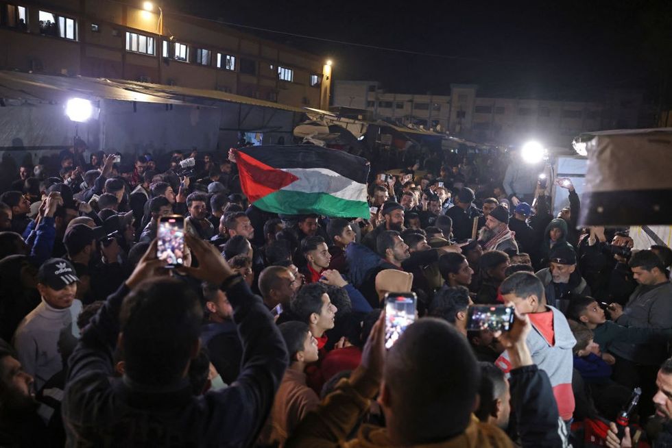 \u200bPeople celebrating in Khan Yunis in the southern Gaza Strip on January 15, 2025