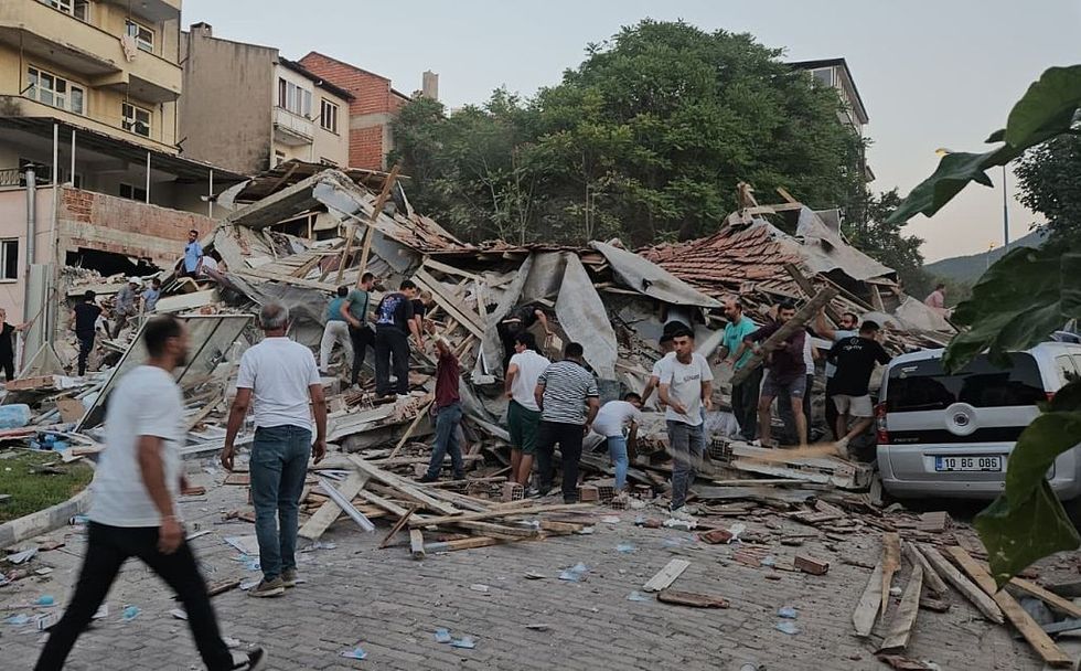 \u200bPeople conduct search and rescue operation after a 6.1-magnitude earthquake struck with its epicenter in the Sindirgi district of Balikesir,
