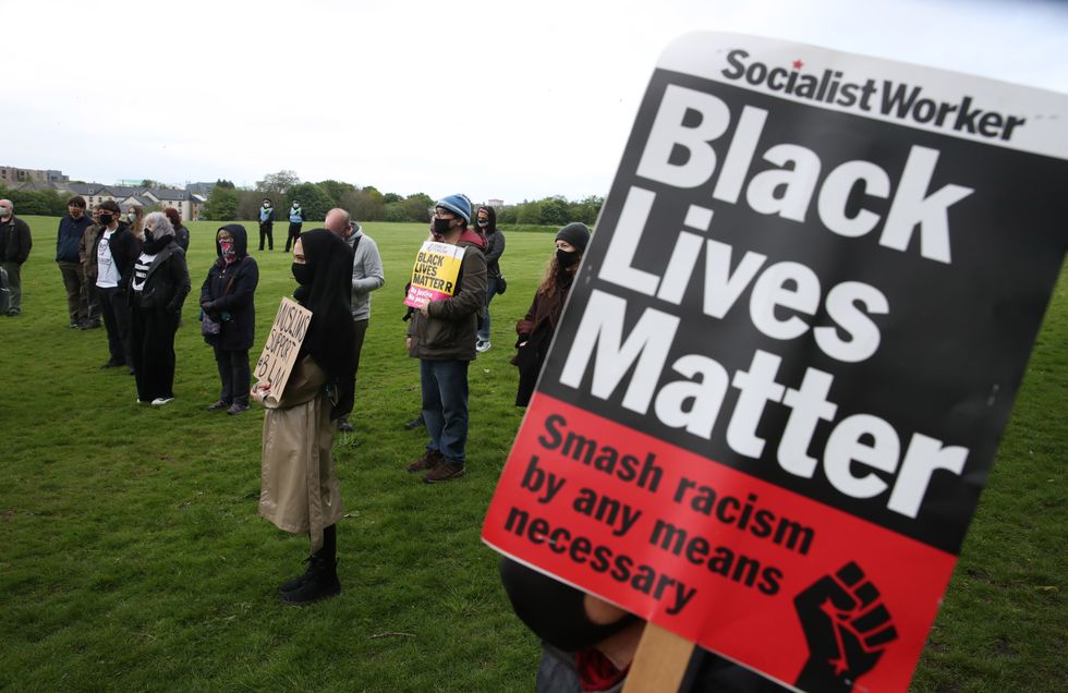 \u200bPeople during a Black Lives Matter rally in Holyrood Park, Edinburgh, to commemorate George Floyd's death