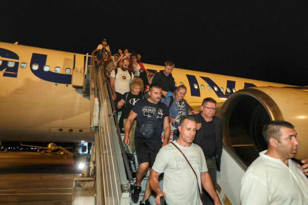 \u200bPeople evacuated from Israel disembark from a plane, amid the Israel-Iran conflict, at Vasil Levski Sofia airport, Sofia, Bulgaria,