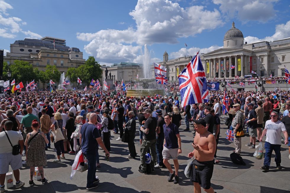 \u200bPeople gather at Trafalgar Square in central London during a protest organised by Tommy Robinson