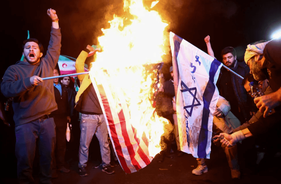 \u200bPeople in Tehran celebrating the ceasefire by gathering and burning Israel and US flags