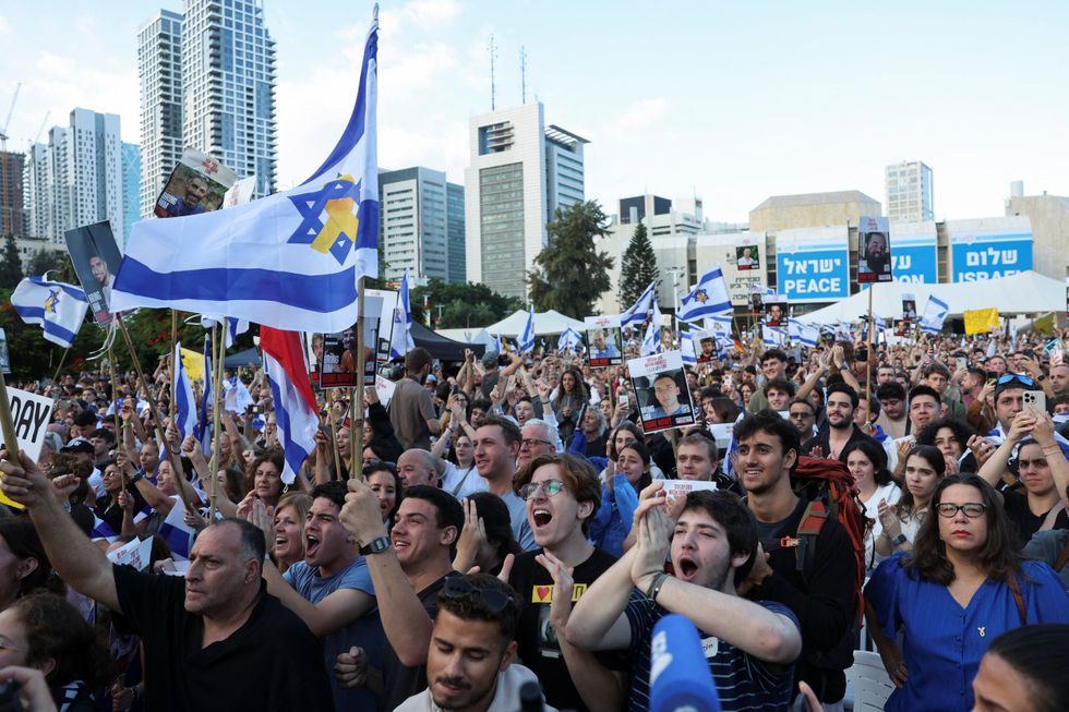 \u200bPeople react at "Hostages Square"