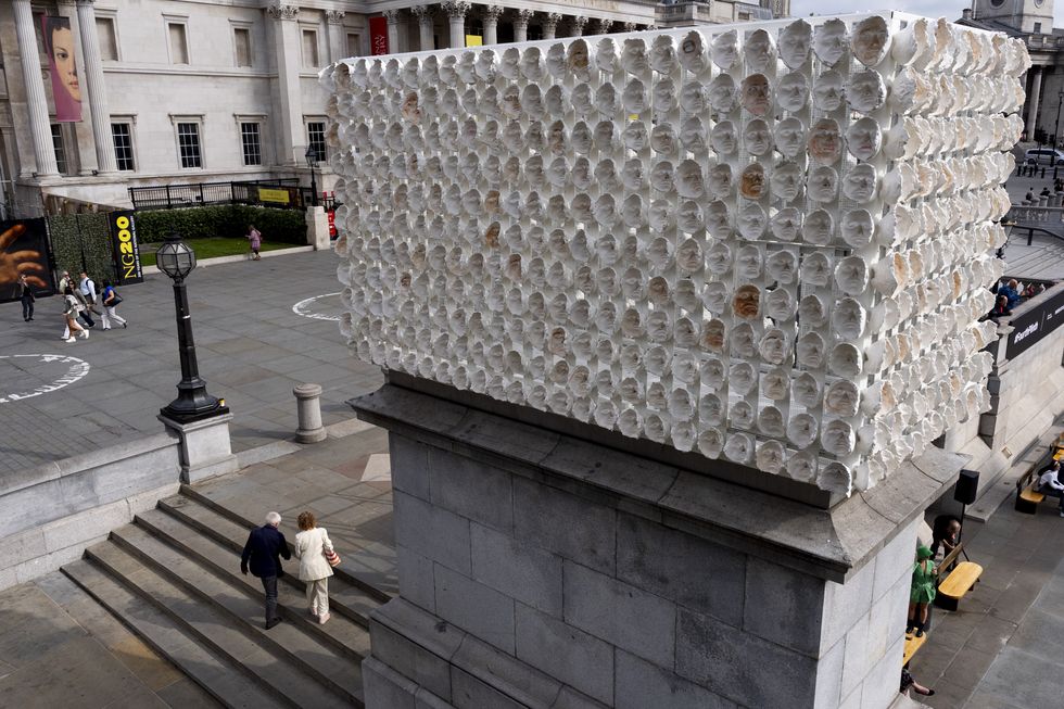 \u200bPeople walk past Mil Veces un Instante (A Thousand Times in an Instant) by Teresa Margolles