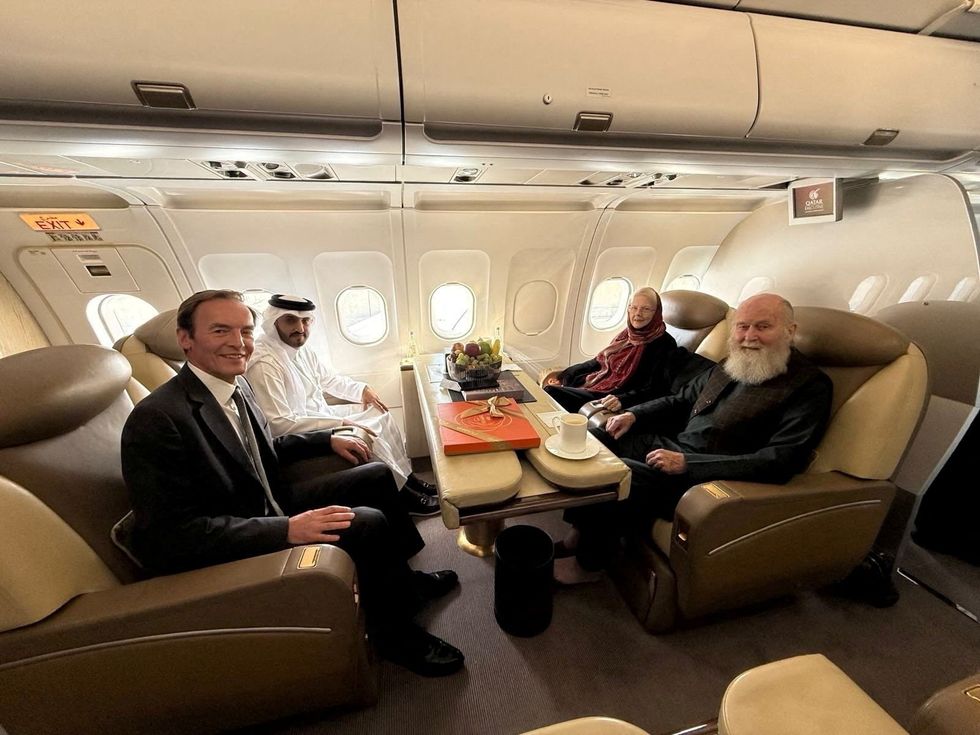 \u200bPeter and Barbara Reynolds, who had been in custody in Afghanistan, sit with Qatari and British diplomats