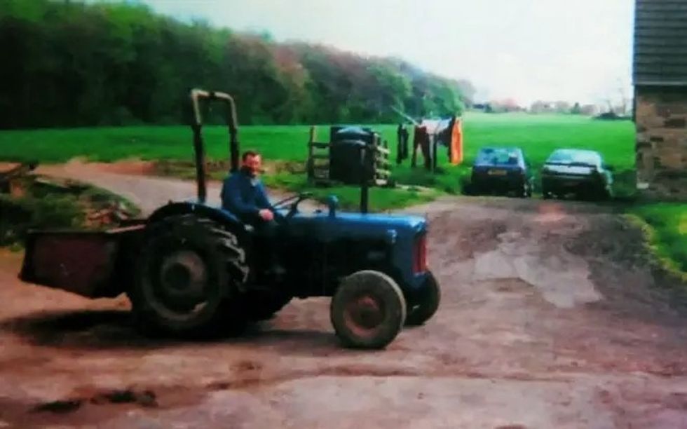 \u200bPhilip Charlesworth driving a tractor on his farm