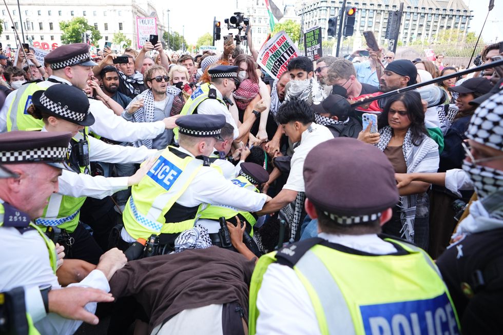 \u200bPolice and demonstrators during a Lift the Ban on Palestine Action protest organised by Defend our Juries