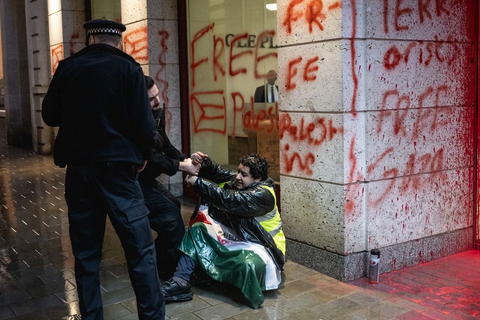 \u200bPolice arresting one of the Palestine protesters