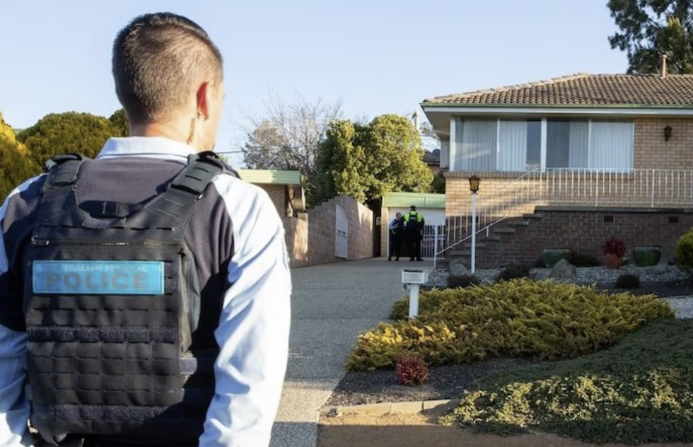 \u200bPolice at the property in Fisher, Canberra