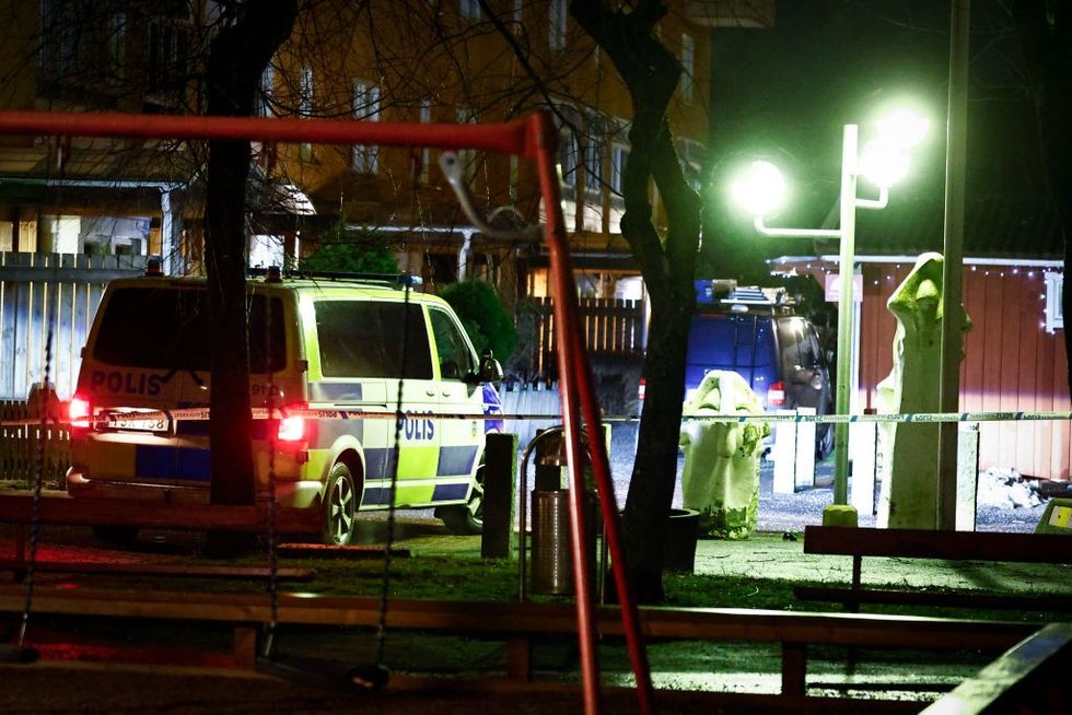 \u200bPolice is seen at a crime scene in an apartment block in Soedertaelje