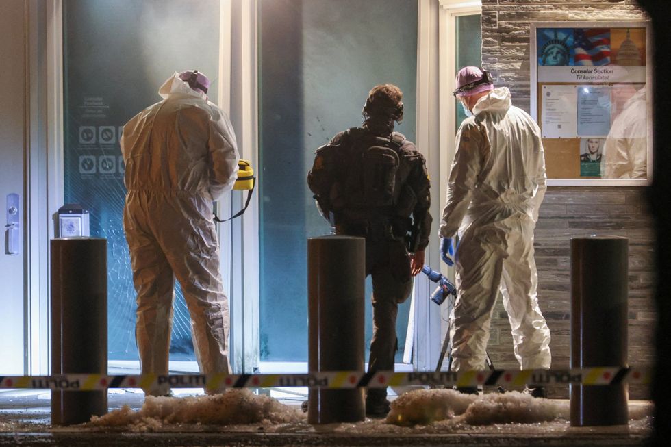 \u200bPolice officers and technicians inspect the American embassy after a loud bang was reported at the site, in Oslo,