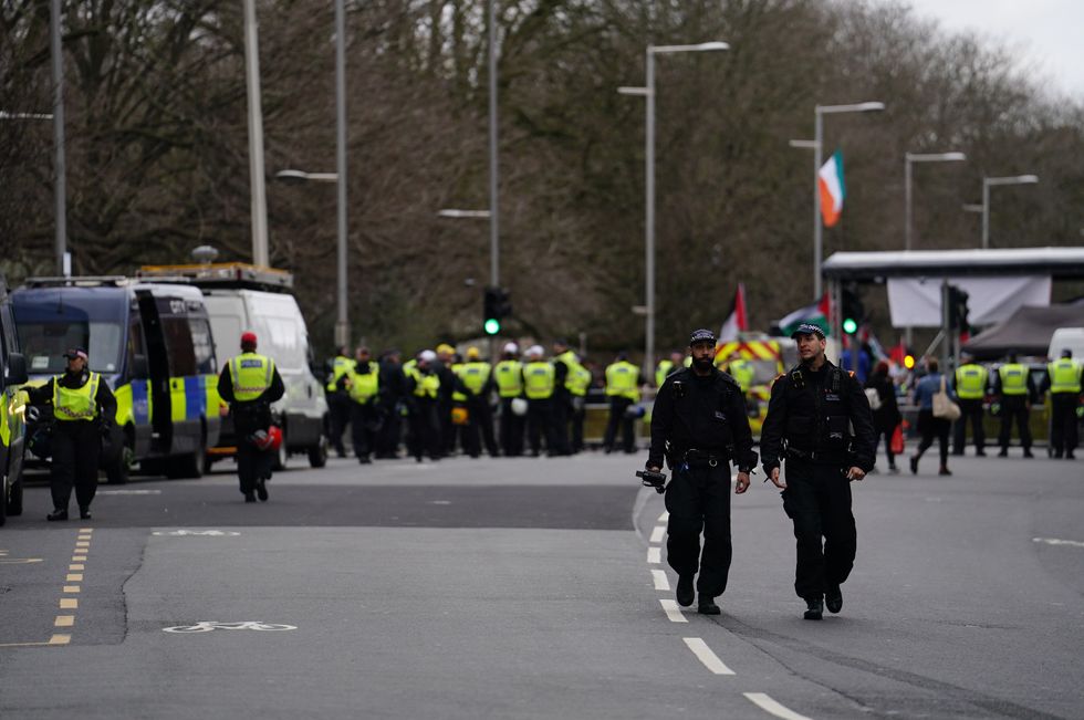 \u200bPolice officers inside the cordon at the Israeli embassy in Kensington High Street, London,