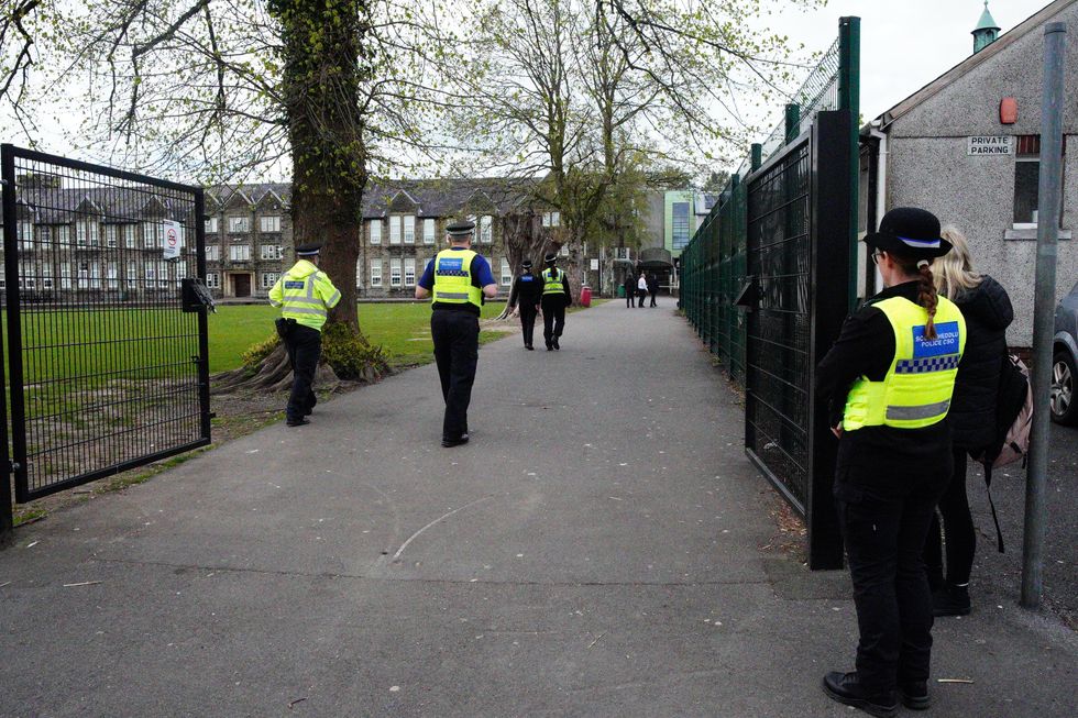 \u200bPolice officers outside Amman Valley school, in Ammanford, Carmarthenshire