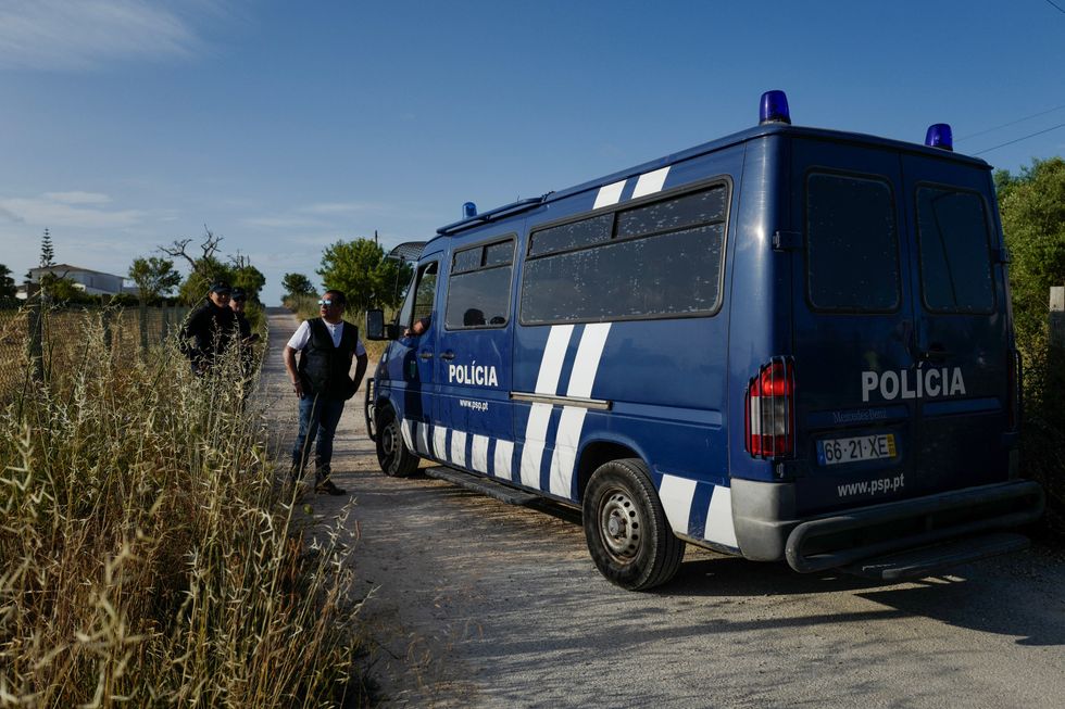 \u200bPolice stand by from the cordoned-off areas