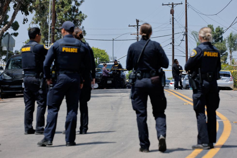\u200bPolice stand guard