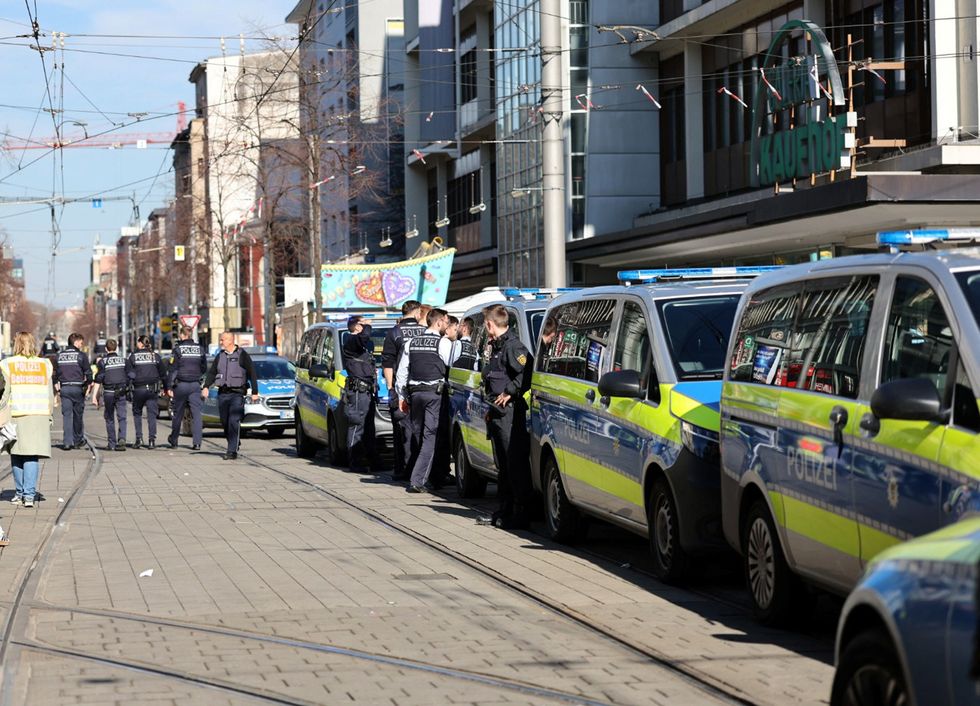 \u200bPolice talk near the scene after a car drove into a crowd, in Mannheim,