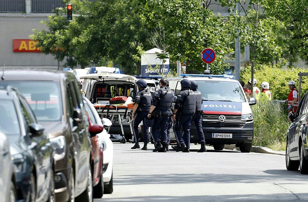 \u200bPolicemen are seen in a street close to a school in Graz