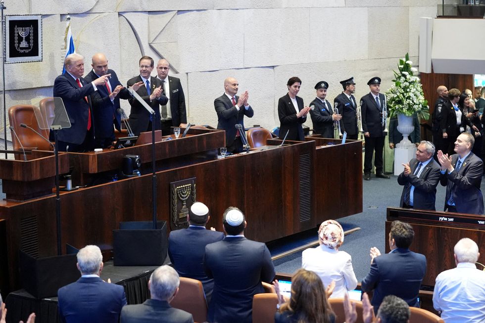 \u200bPresident Donald Trump arrives with Speaker Amir Ohana and Israel's President Isaac Herzog to speak to the Knesset