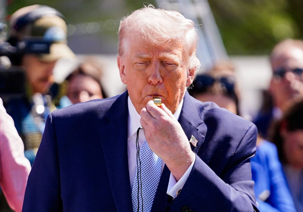 \u200bPresident Donald Trump blows a whistle during the 2026 White House Easter Egg Roll