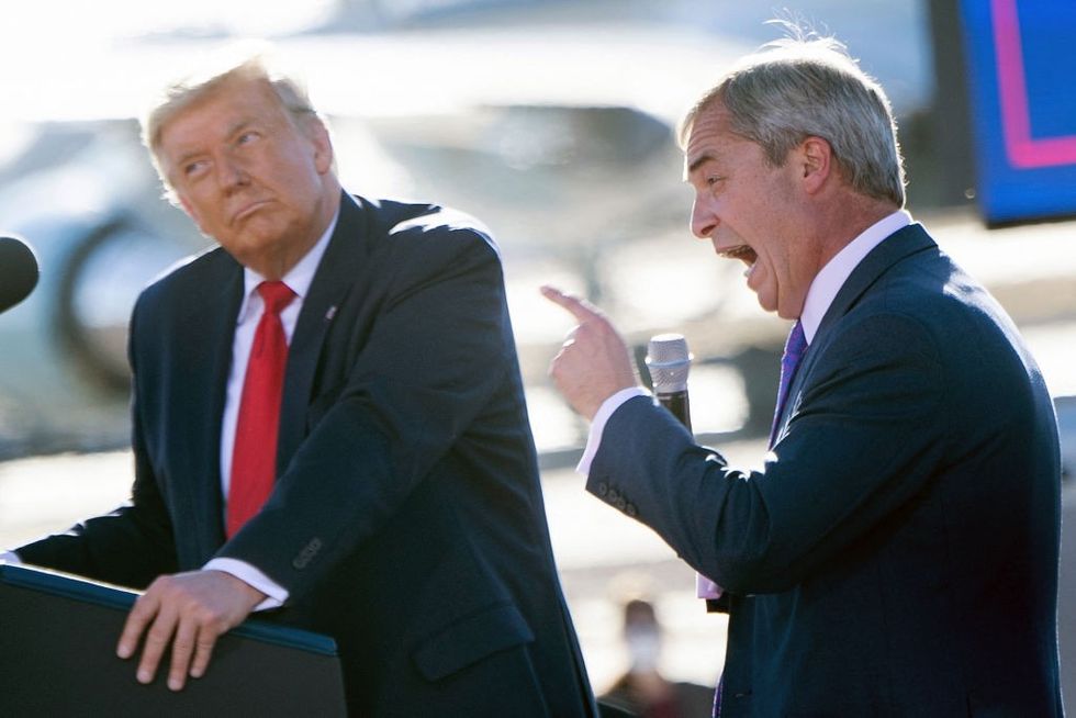 \u200bPresident Donald Trump listens as Nigel Farage