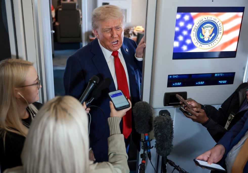 \u200bPresident Donald Trump speaks to the media aboard Air Force One