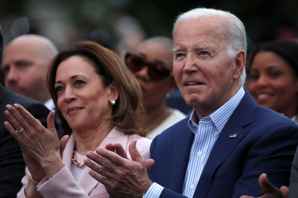 \u200bPresident Joe Biden claps hands next to Vice-President Kamala Harris