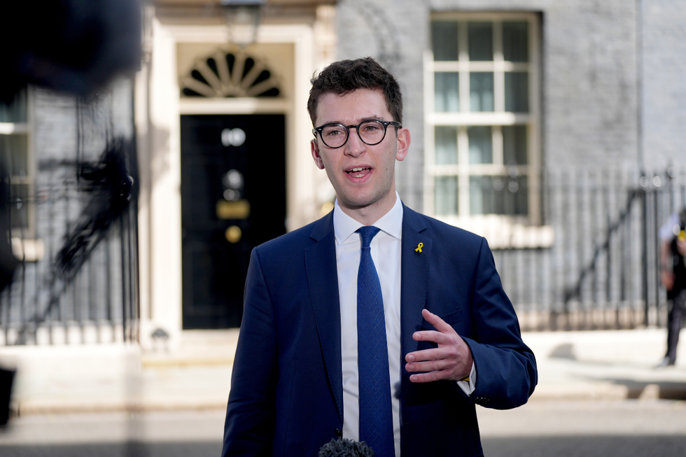 \u200bPresident of the Union of Jewish Students (UJS) Edward Isaacs speaks to reporters outside Downing Street