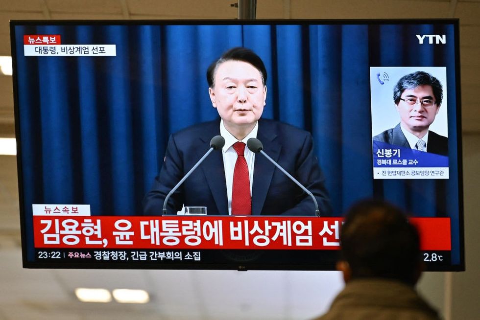 \u200bPresident Yoon Suk Yeol speak during a news broadcast on a television at a train station in Seoul