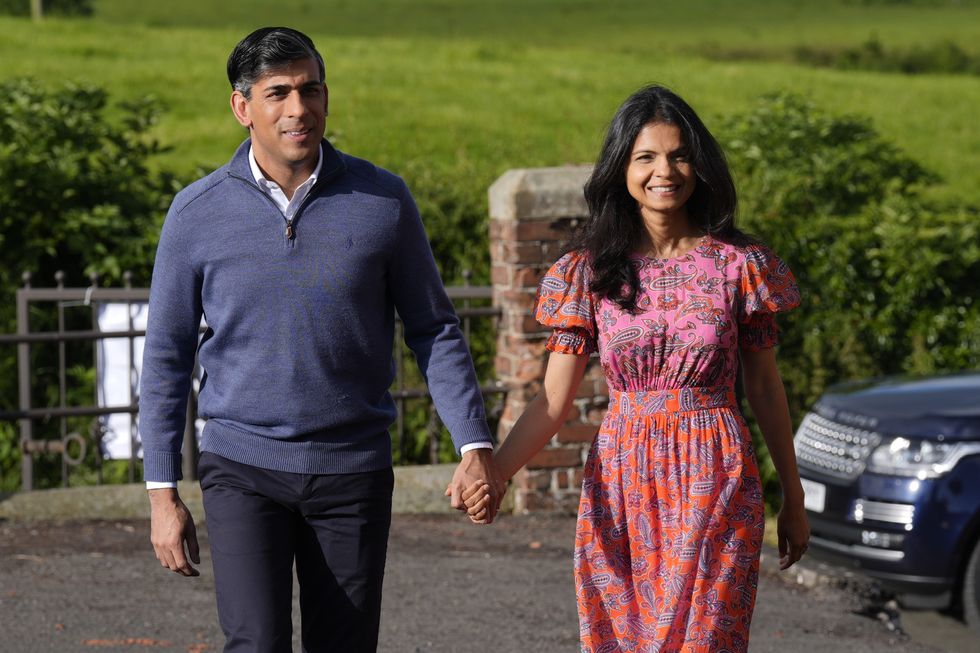 \u200bPrime Minister Rishi Sunak and his wife Akshata Murty arrive to cast their vote