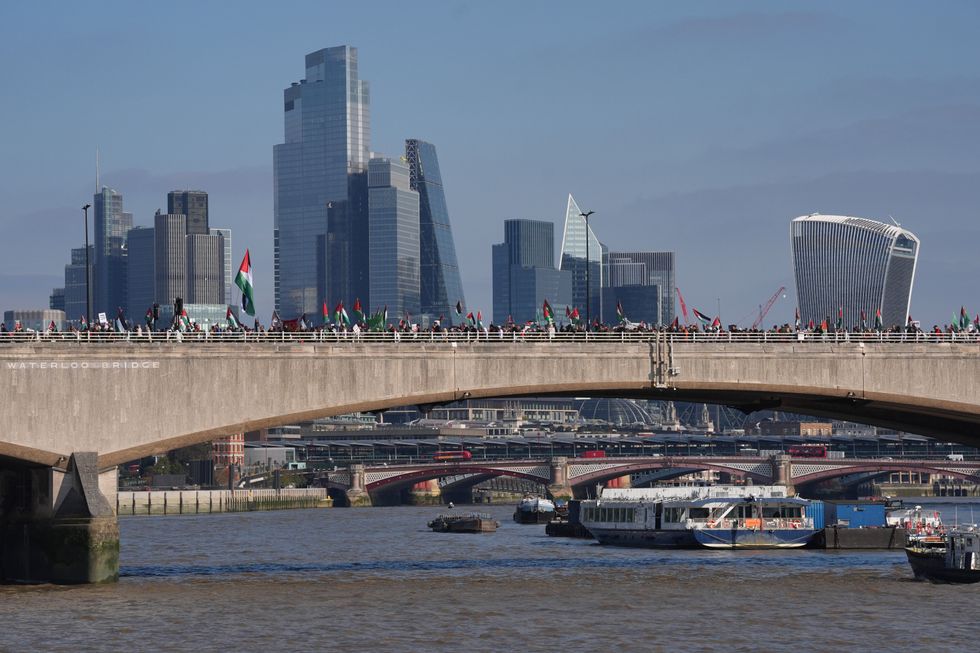 \u200bPro-Palestine protesters seen walking along Waterloo Bridge
