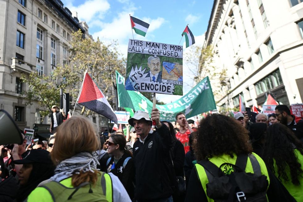 \u200bPro-Palestinian activists and supporters wave flags and hold placards as they pass through central London, during a March for Palestine on October 5, 2024