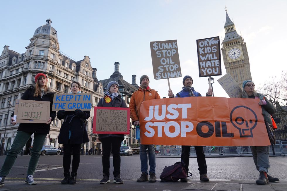 \u200bProtesters from Just Stop Oil, Extinction Rebellion, Fossil Free London and Scientist Rebellion take part in an "emergency demonstration" at Parliament Square,