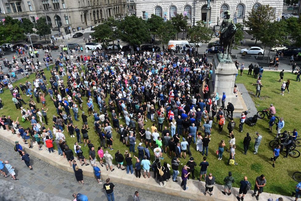 \u200bProtesters gather outside the Liver Building in Liverpool
