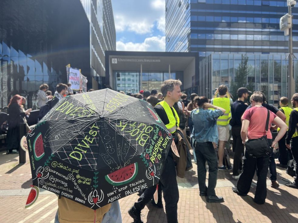 \u200bProtesters gathered outside the campus building