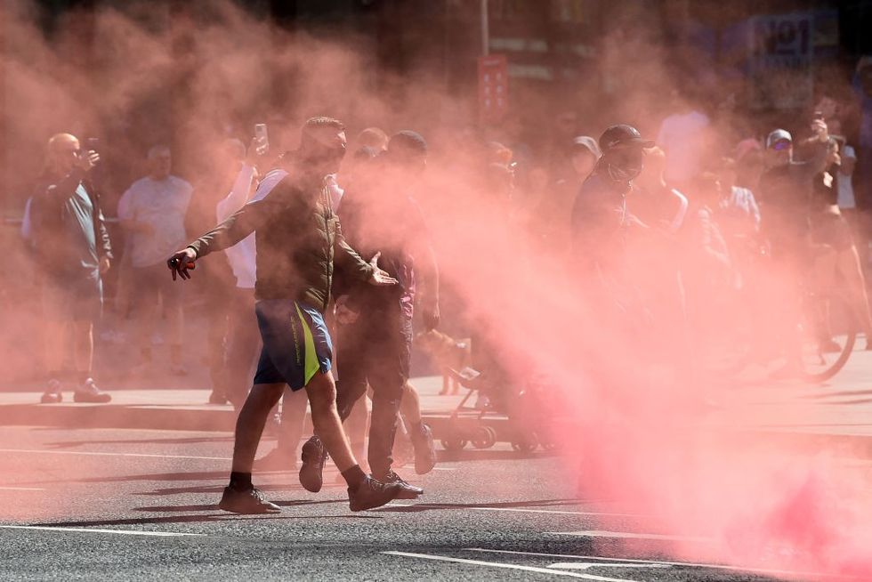 \u200bProtesters throw flares towards police officers in Liverpool