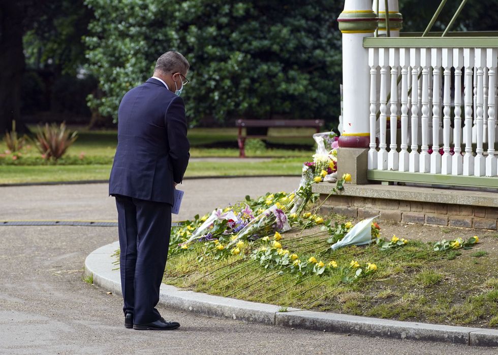 \u200bReading West MP Alok Sharma lays a floral tribute at Forbury Gardens in Reading