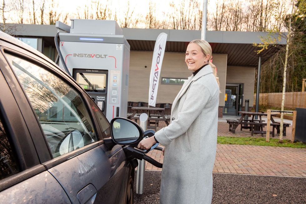 \u200bRebecca Parramore charges her BYD Dolphin at the InstaVolt Superhub in Winchester