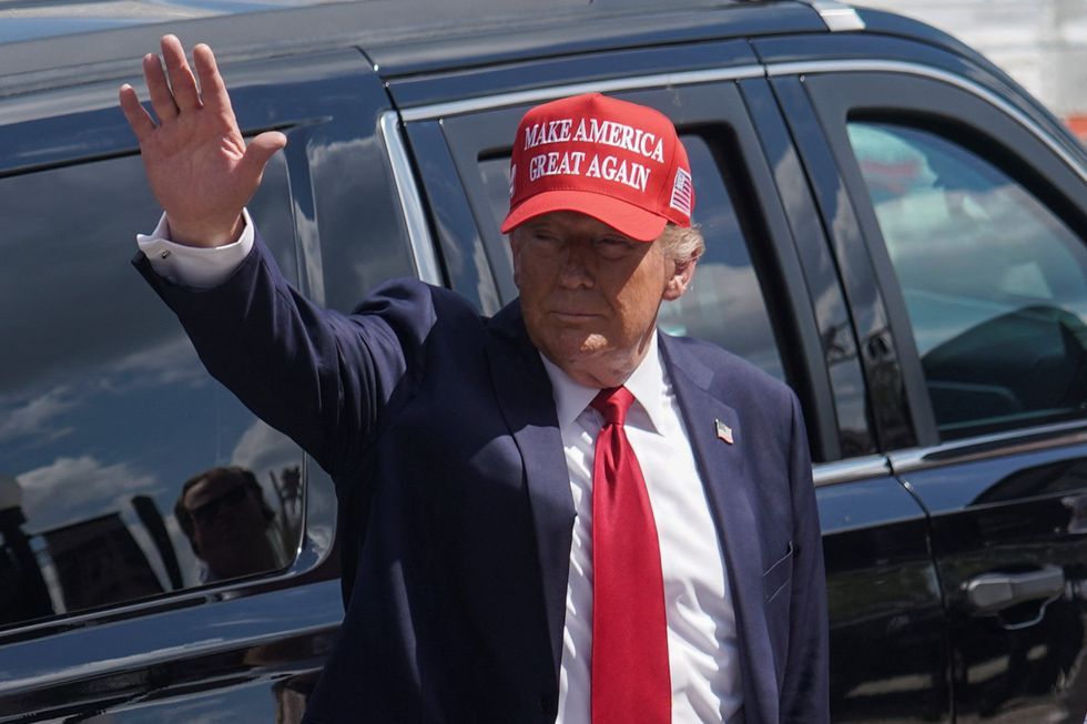 \u200bRepublican presidential nominee and former US President Donald Trump gestures as he attends an event about the damage caused by Hurricane Helene, in Valdosta, Georgia